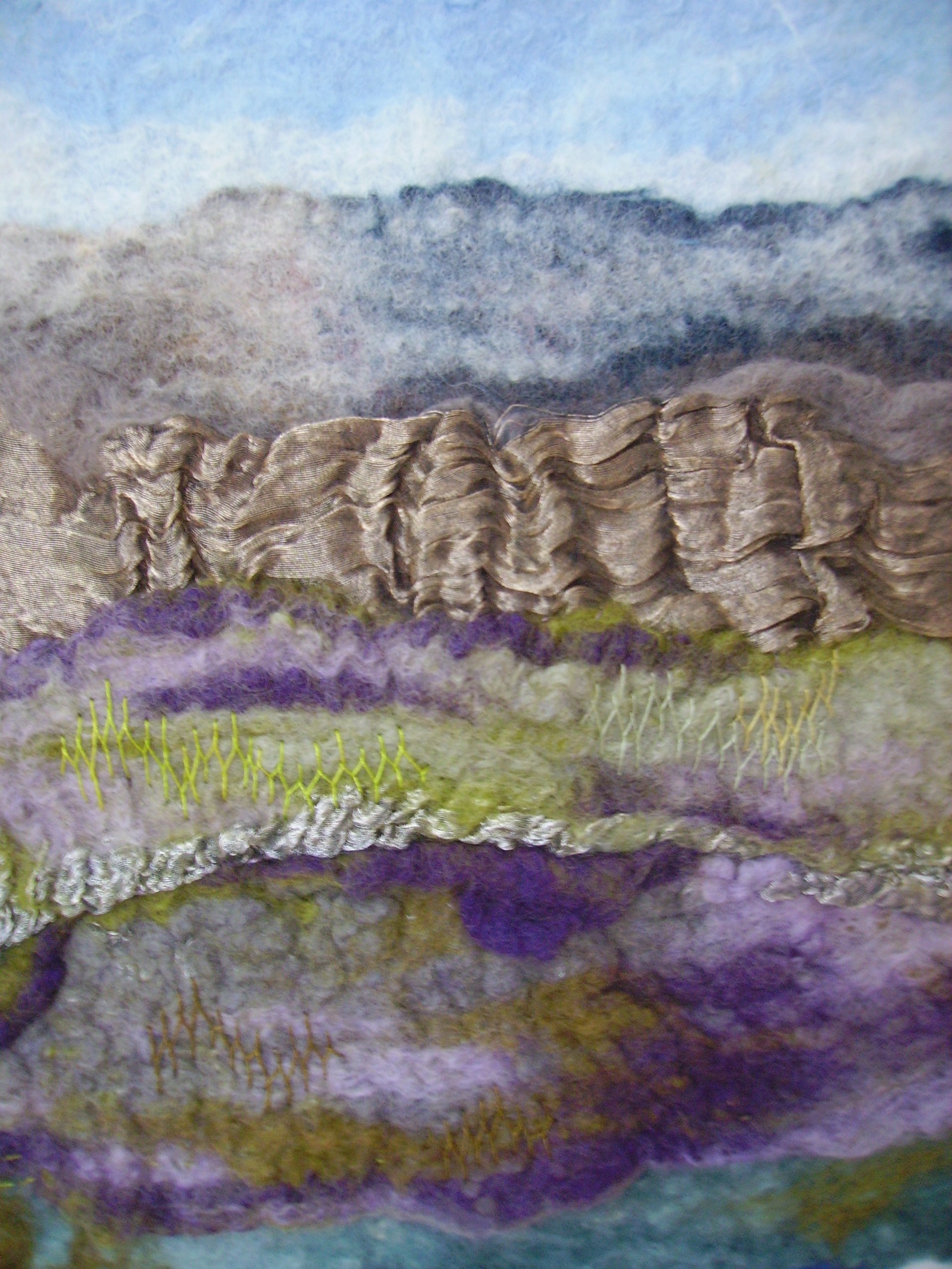 Hand felted and embroidered manipulated wool
